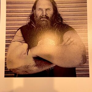 Photo of Hell’s Angel with arms crossed in B/W